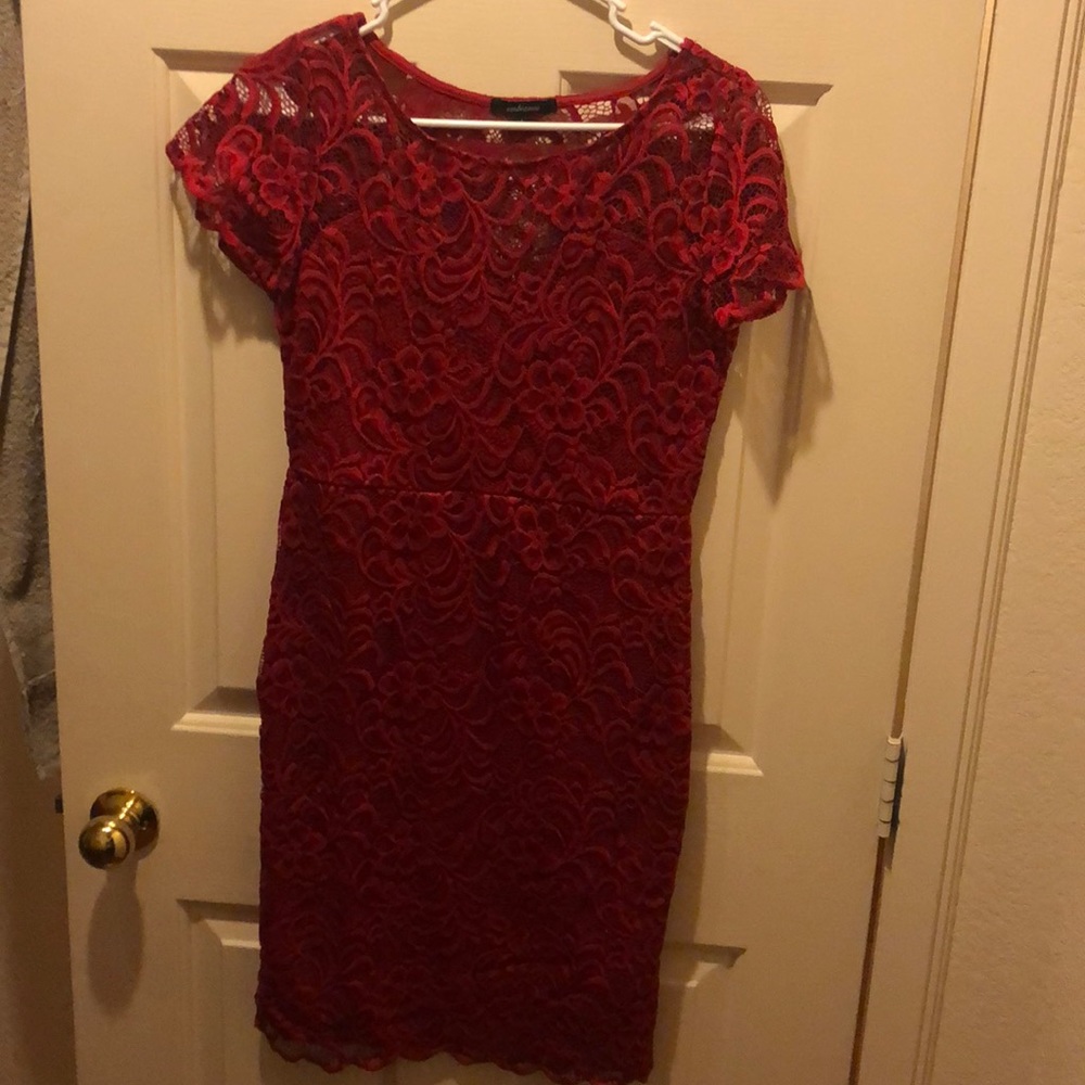 Stunning red lace dress with open back.